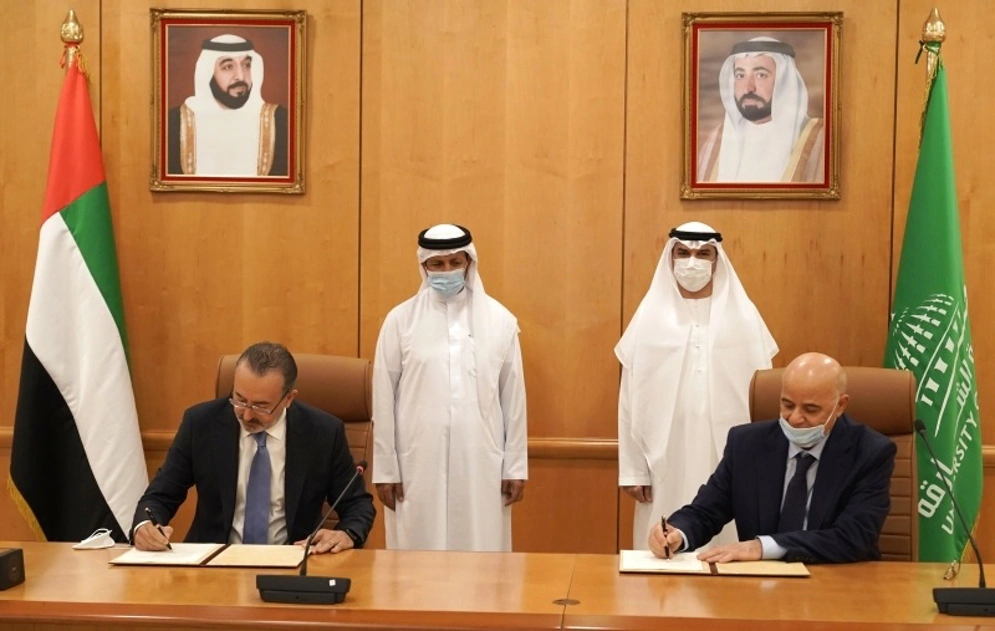 Signing the agreement: University of Sharjah Director, Dr. Hamid Majool Al-Nuaimi, and Executive Vice President of CPT, Roger Kakhia. Photo credit: courtesy Albayan.ae – Sep 21st, 2020
