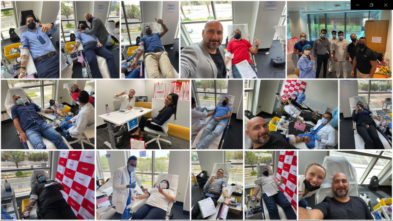 Team members giving blood during the drive. Photo credit - Ivanti