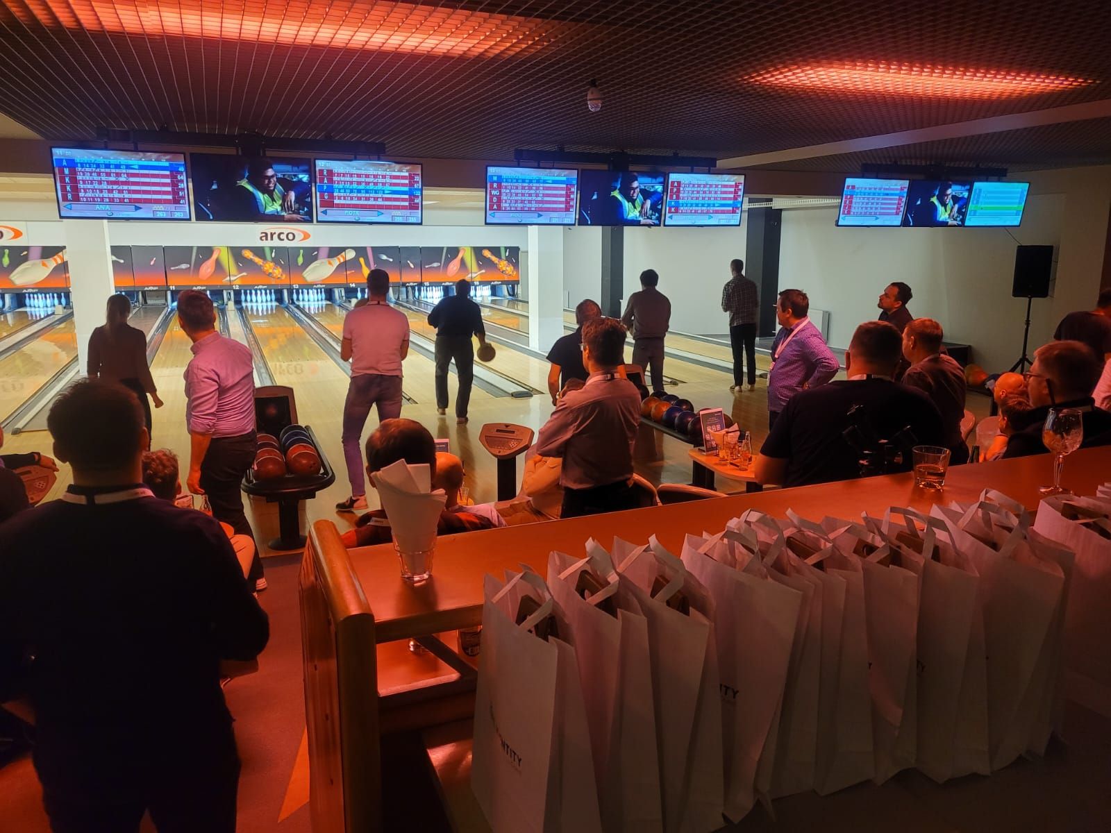 group of people in a bowling alley 
