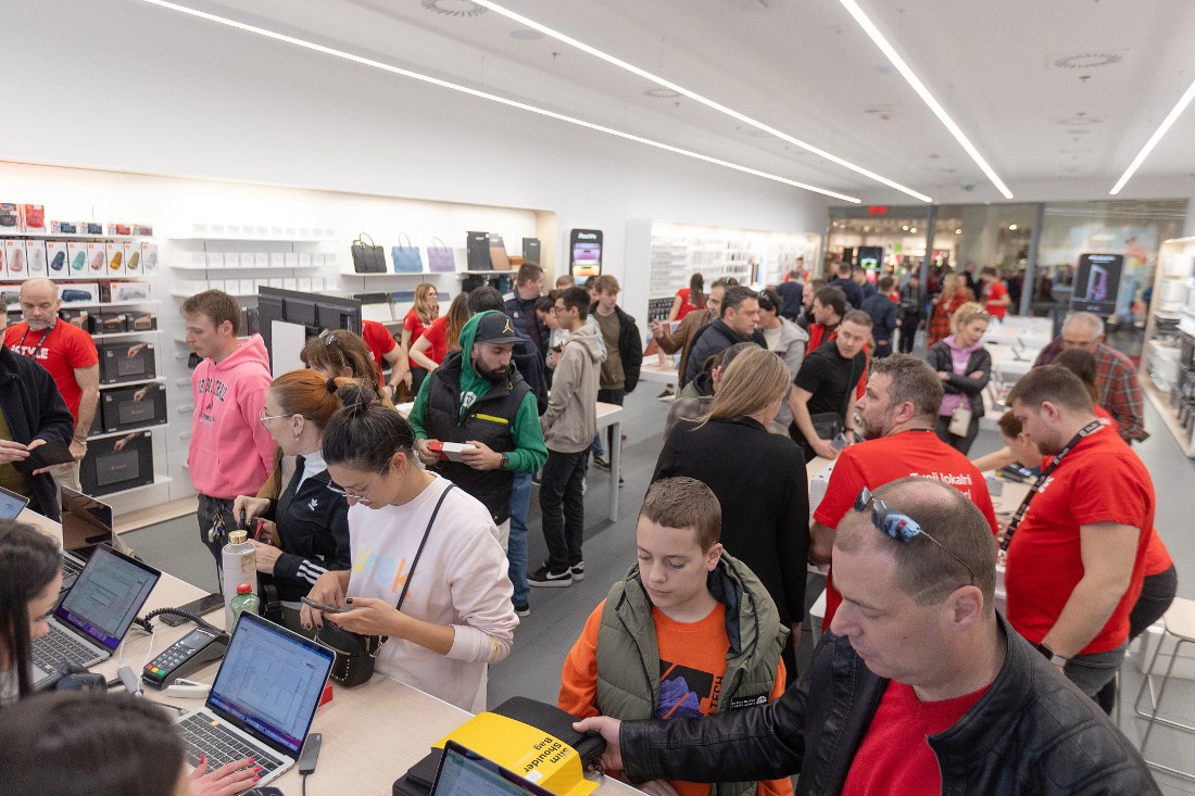 many people are seen at an opening event in a hi tech store