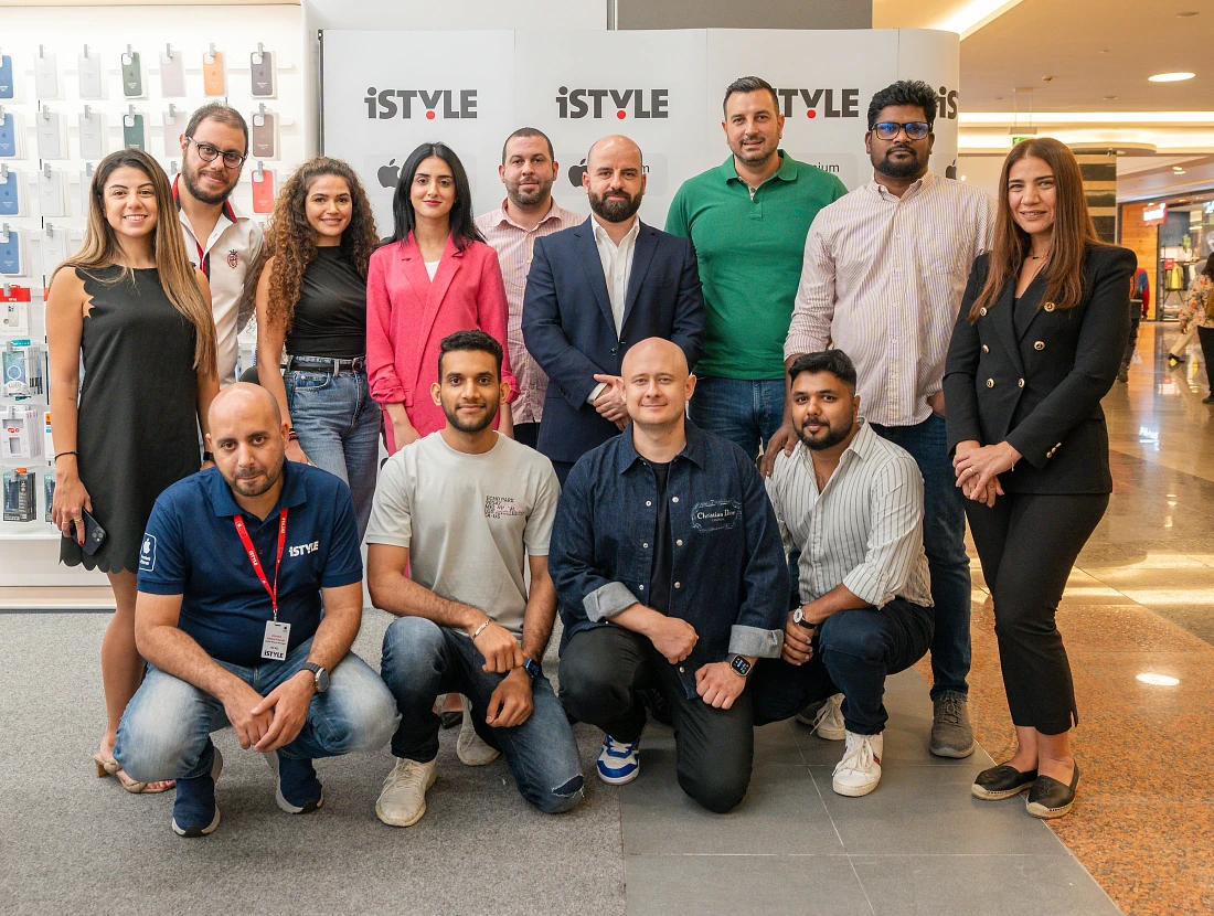 group photograph of 13 people from iSTYLE team at Dalma Mall