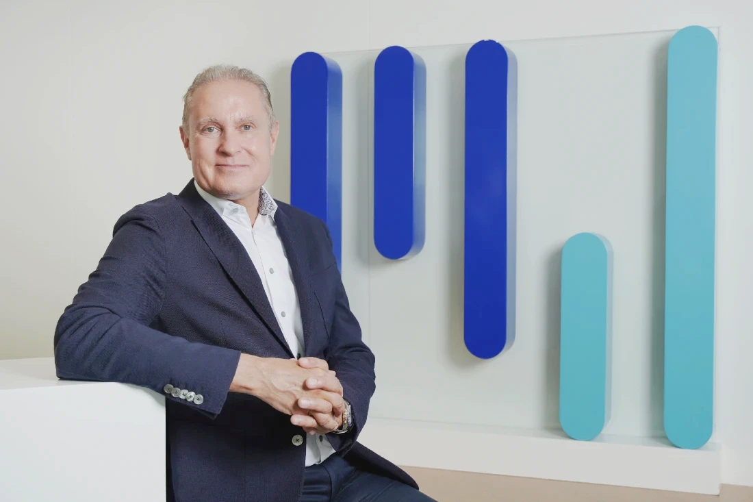 Head and shoulders photo of a man in a suit