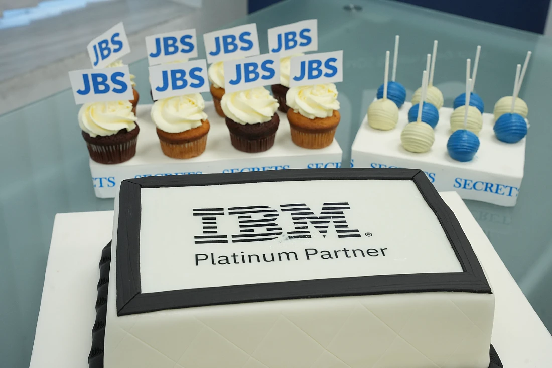 a decorated cake with IBM Platinum Partner spelt out on top