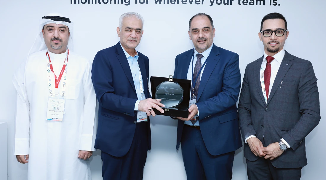 group photograph of four men at a hi tech event