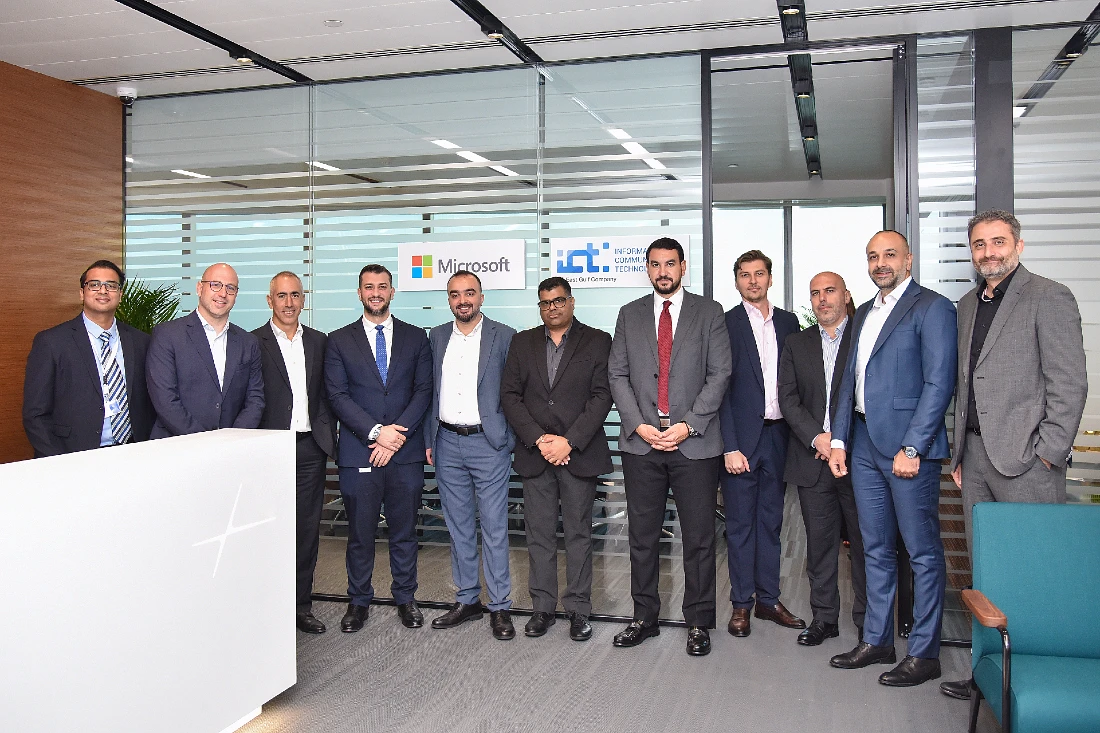 eleven men in a boardroom setting in a group photograph