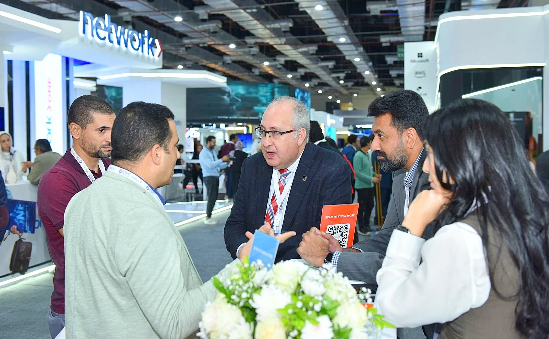 Five people talking together at a hi-tech event