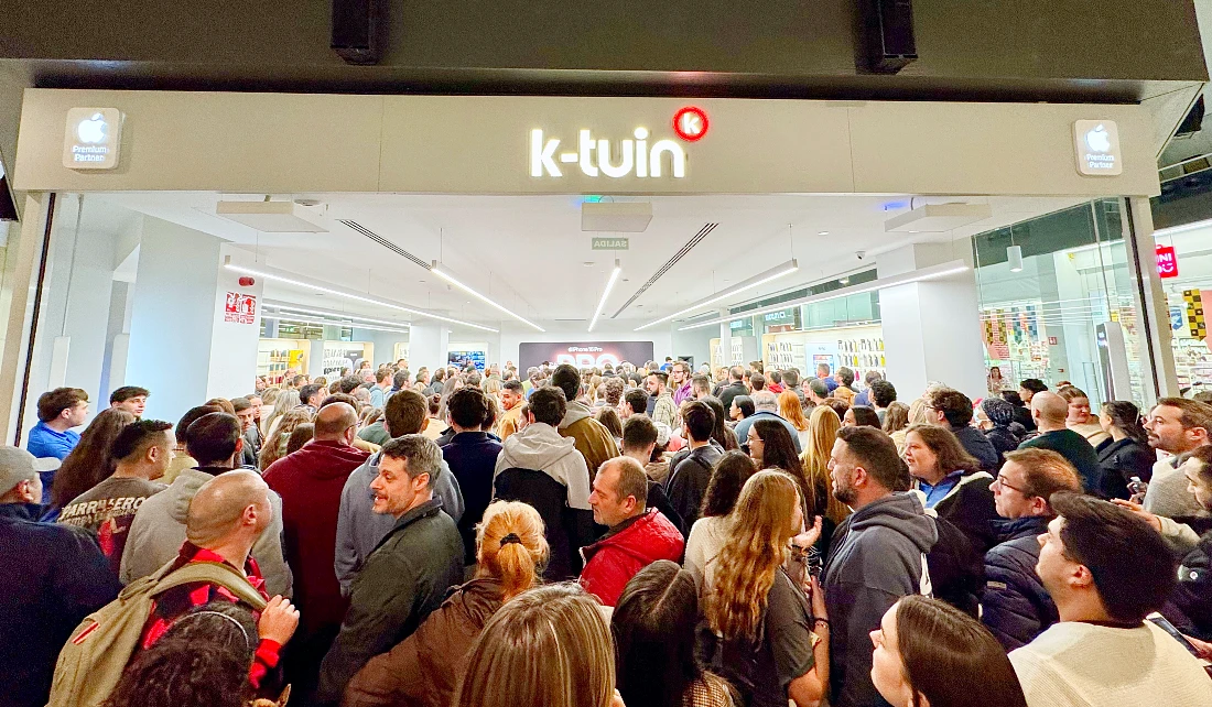 a large crowd of people are seen in front of a hi tech store