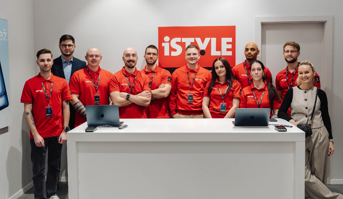 a group photograph of the iSTYLE team, mostly wearing red t-shirts